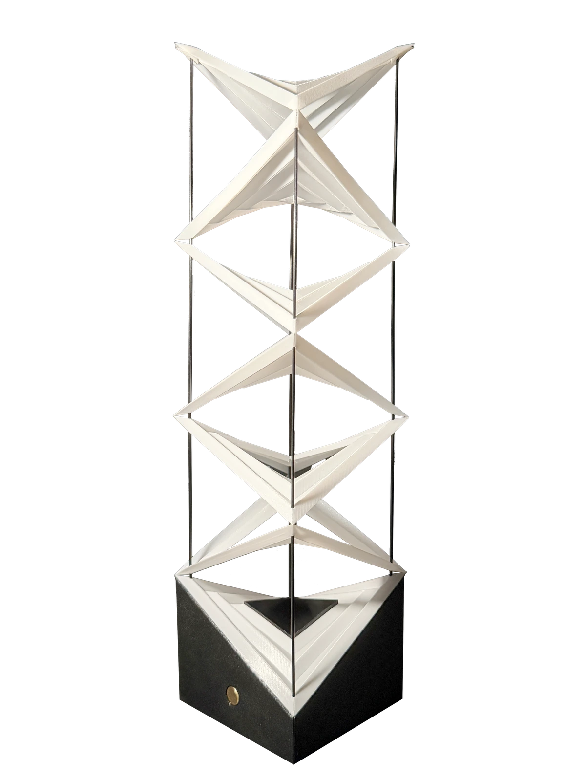 Float, a table lamp of stacked folded planes on a black base